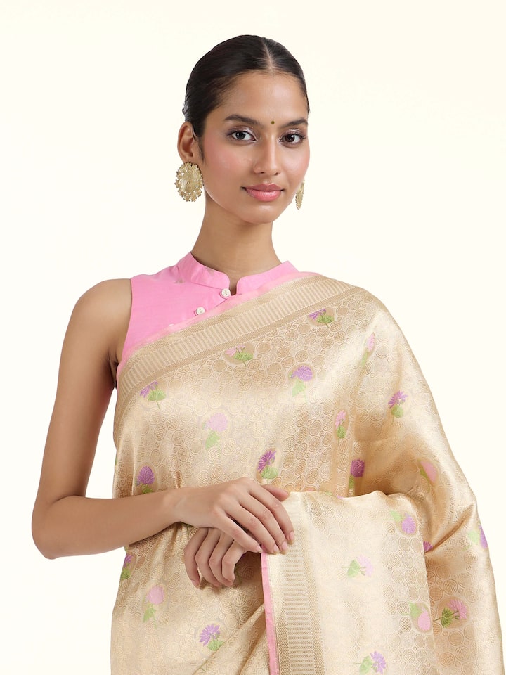 Angled view of Off-white Banarasi Brocade Silk Saree revealing the depth of its color and intricate pattern