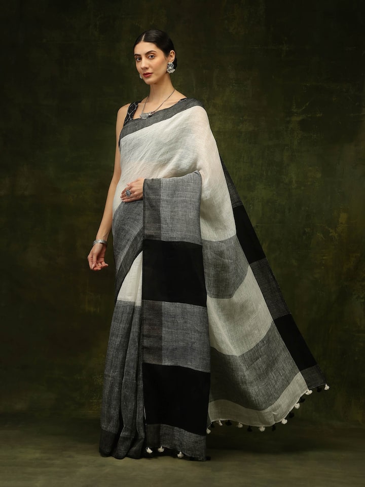 Lifestyle view of black linen saree draped gracefully with contemporary styling