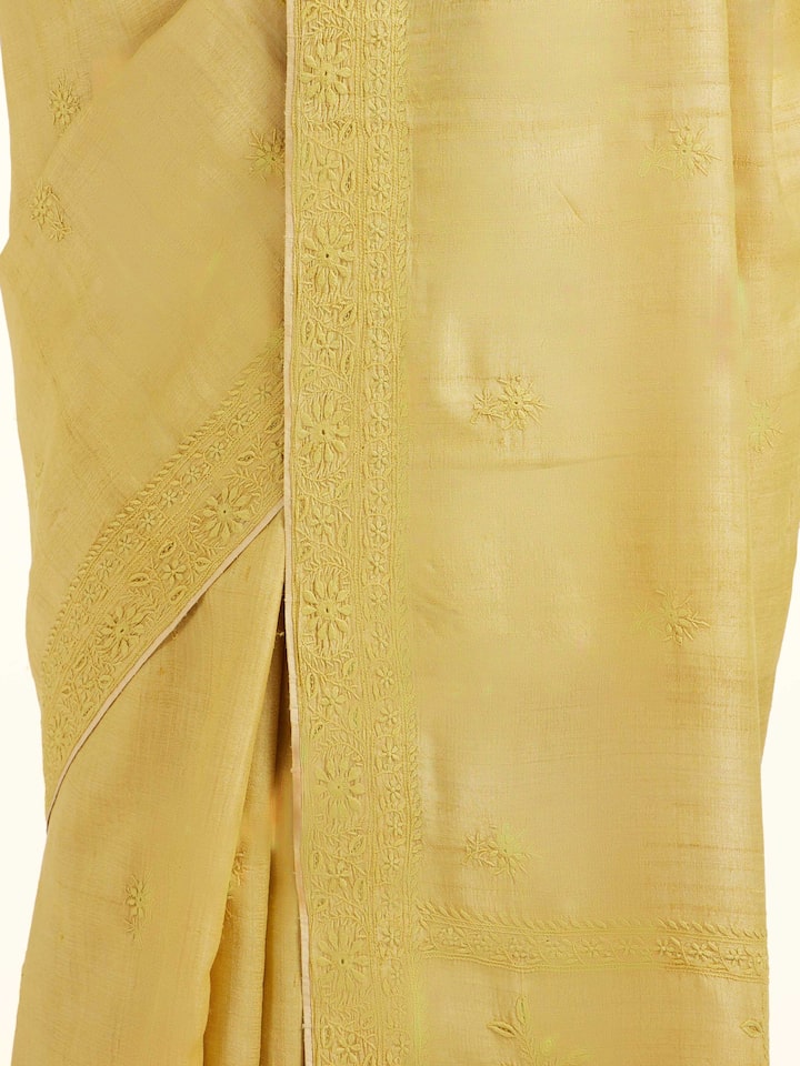 Detail view of yellow silk Chikankari saree showing silk texture and embroidery finesse