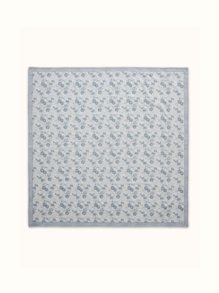 Front view showcasing the delicate light blue floral patterns hand block printed on soft cotton linen fabric