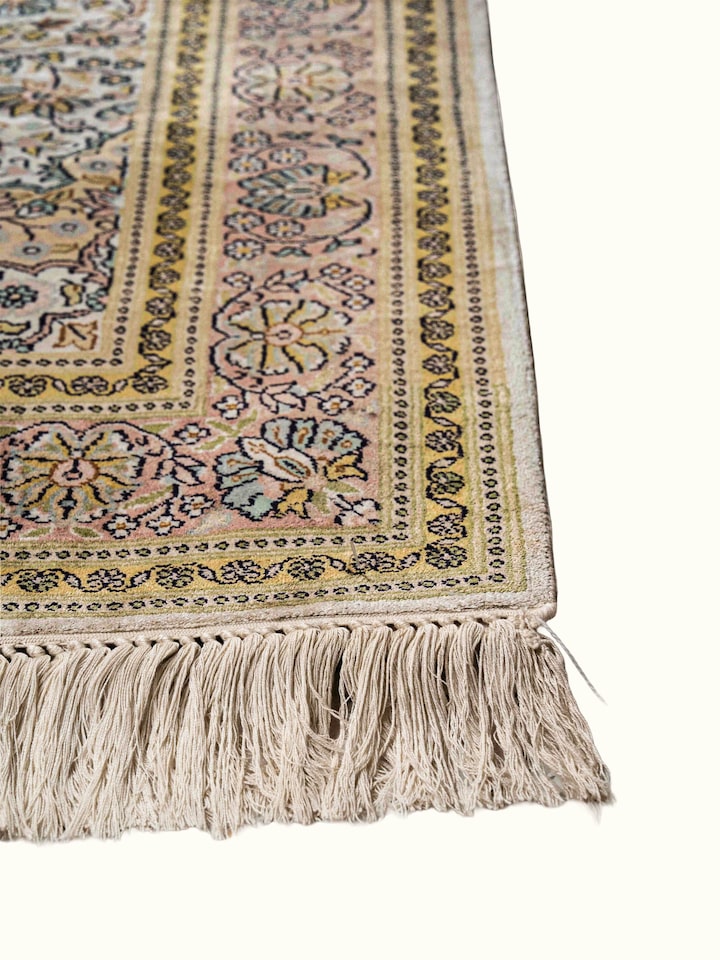 Close-up view of Traditional Persian Ivory Kashan Kashmir Silk Hand-Knotted Carpet highlighting the hand-knotted weave and motif detail