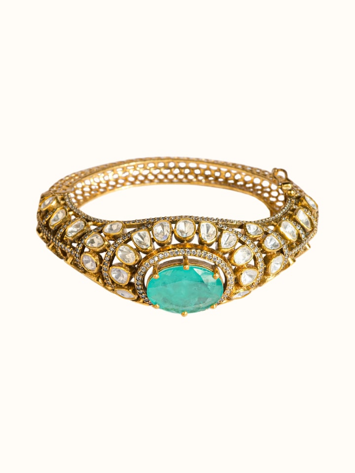 angled view of silver smithing gold plated bangle