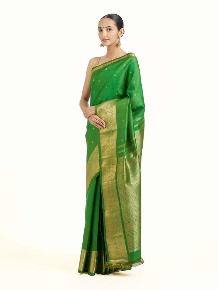 Side view of green silk Kancheepuram saree showcasing elegant drape