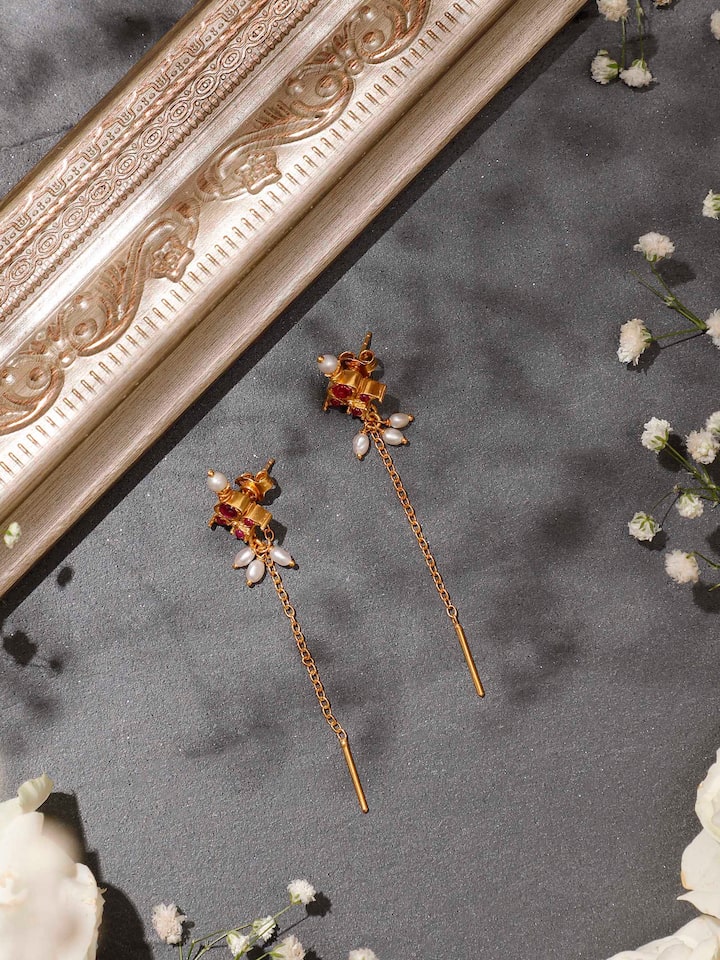 Styled detail view of Guttapusalu Silver Drop Earrings worn on the ear, shown in an alternate styled shot, from a different angle