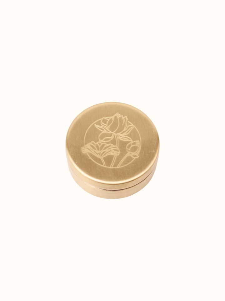 Close-up view of Solid Perfume Sugandh highlighting the packaging label detail, from a different angle