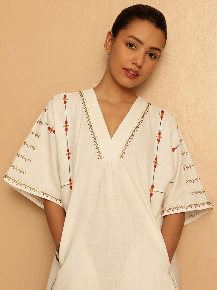 Close-up of the neckline to reveal detailed threadwork and embroidery.