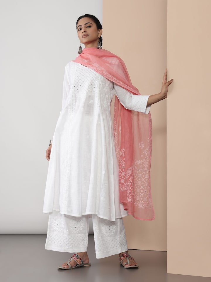 Model wearing white Chikankari kurta, showcasing the elegant embroidery and relaxed A-line silhouette.