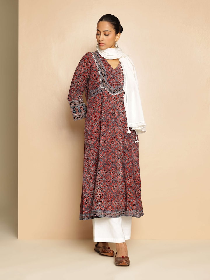 Lifestyle view of model wearing Ajrakh block print A-line kurta with three-quarter sleeves
