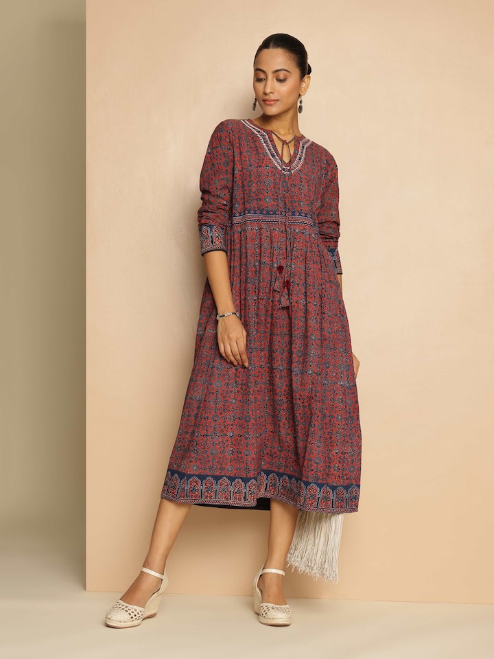 Blue cotton Ajrakh block printed tie-up midi dress lifestyle view styled with accessories in an outdoor setting