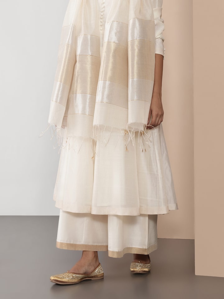 Side view emphasizing soft pleats and airy structure.