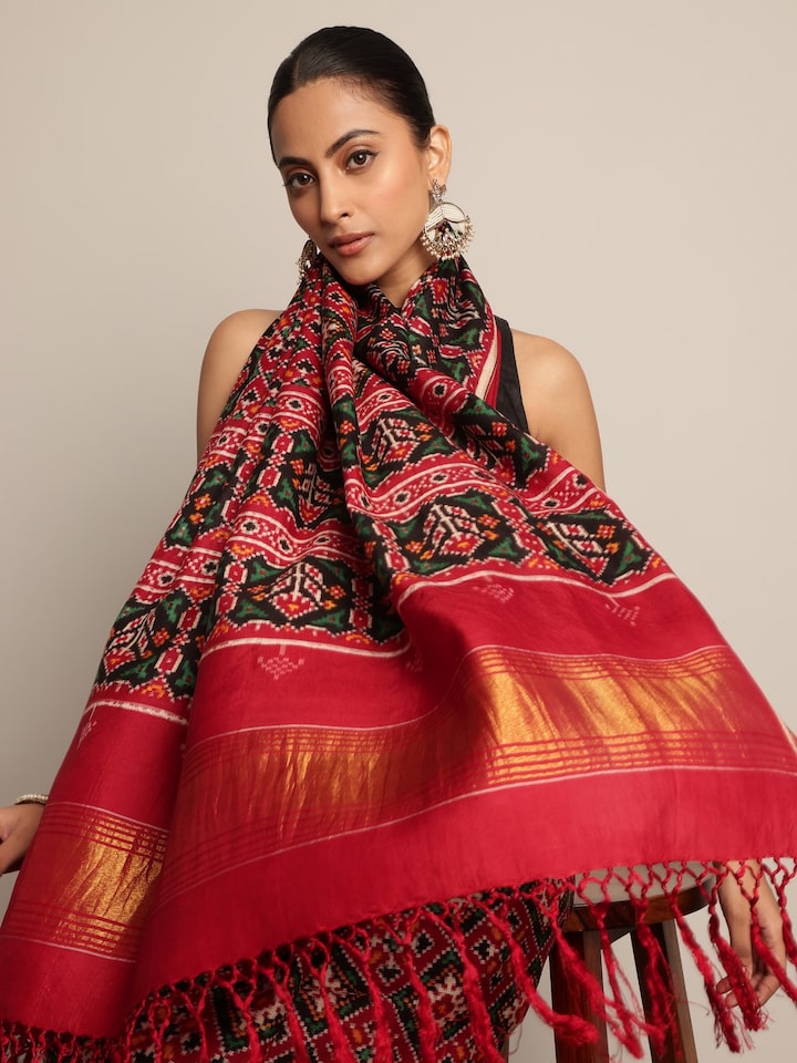 Close-up detail of Red & Green Mulberry Silk Patan Patola Saree focusing on detailed weaving and silk sheen.