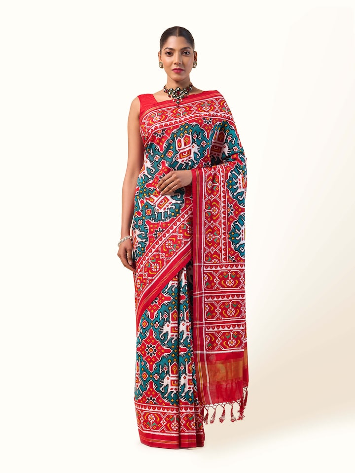 Front view of Green Mulberry Silk Patan Patola Saree displaying rich green silk and intricate Patola design.