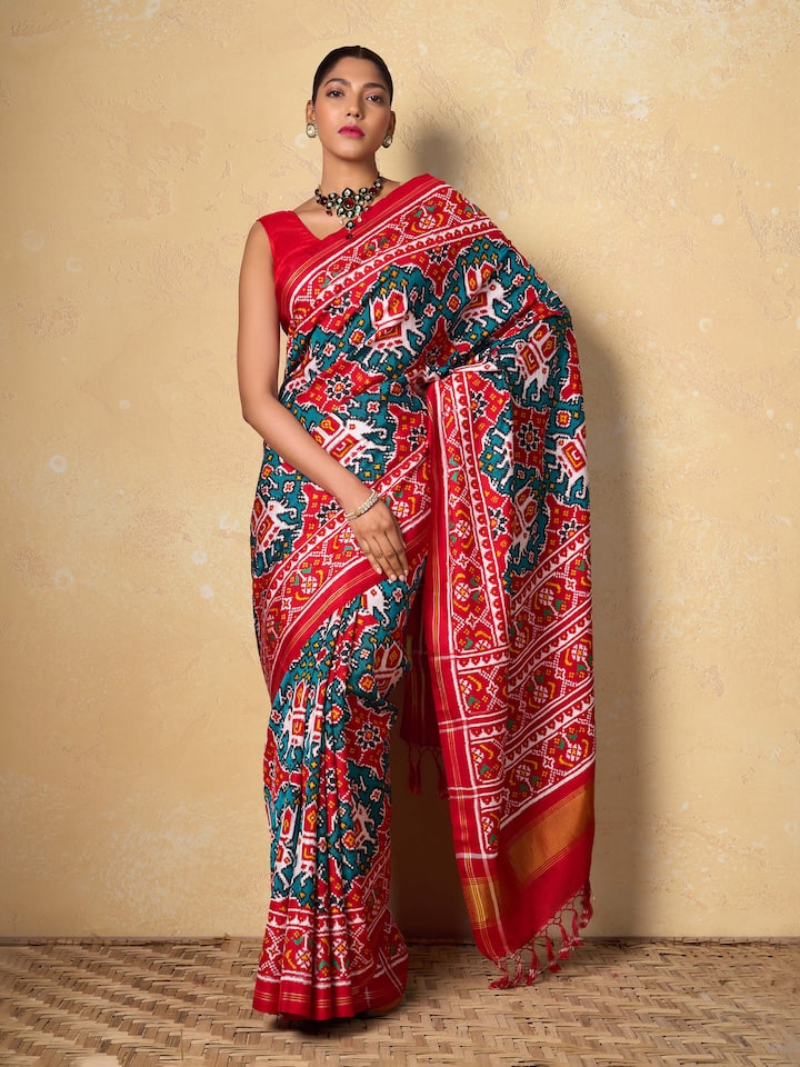 Lifestyle view of Green Mulberry Silk Patan Patola Saree draped on model showcasing elegance.