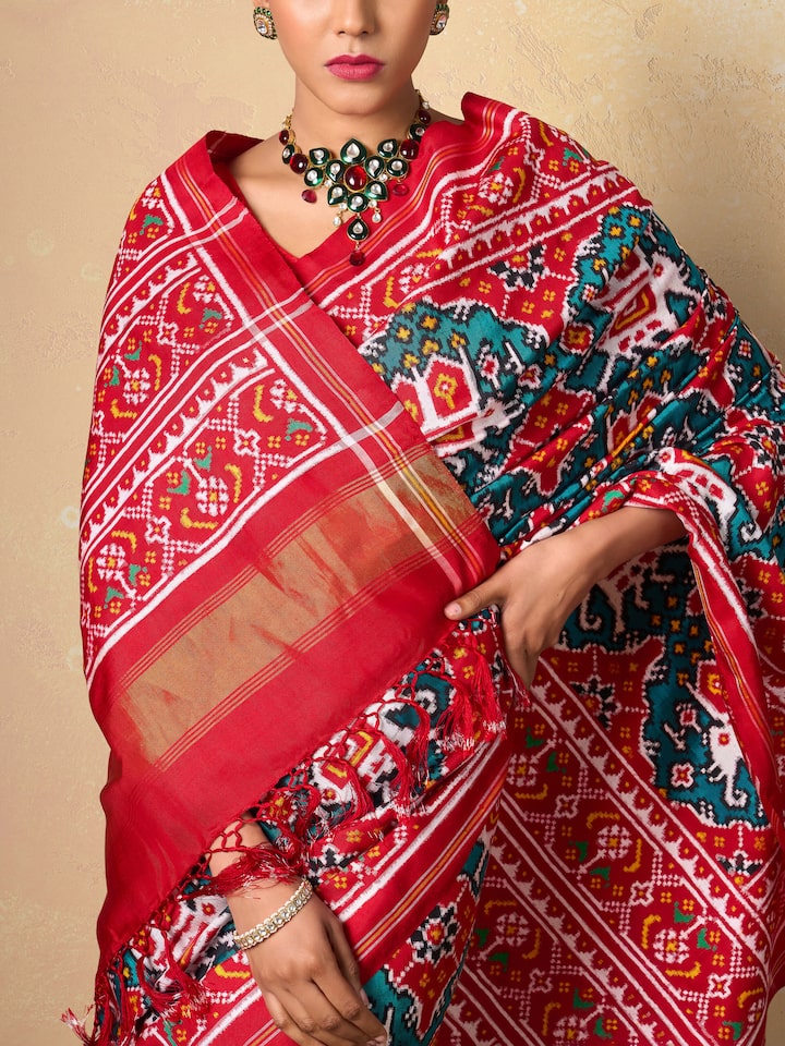 Close-up detail of Patan Patola weave and motifs on Green Silk Saree.