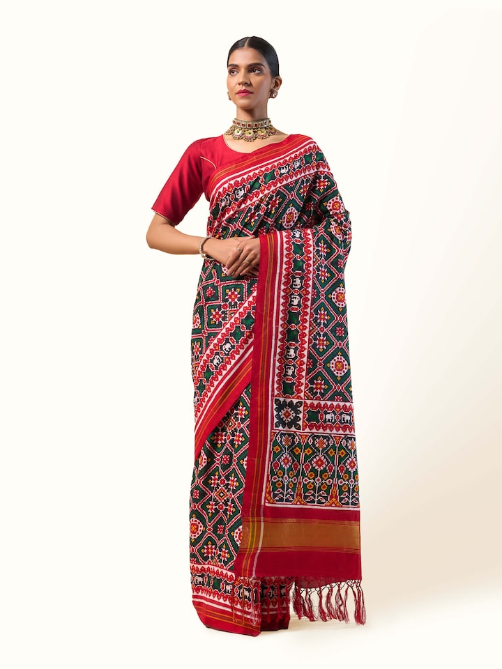 Red mulberry silk Patan Patola saree front view highlighting vibrant colors and traditional Patola motifs