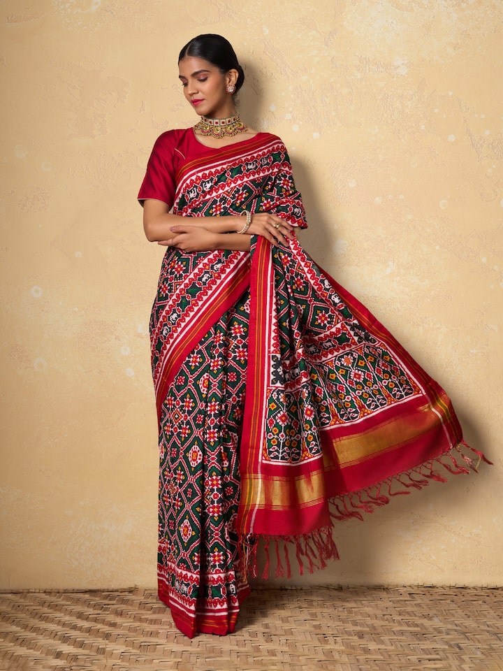 Red mulberry silk Patan Patola saree lifestyle view styled on model showing drape and silk sheen