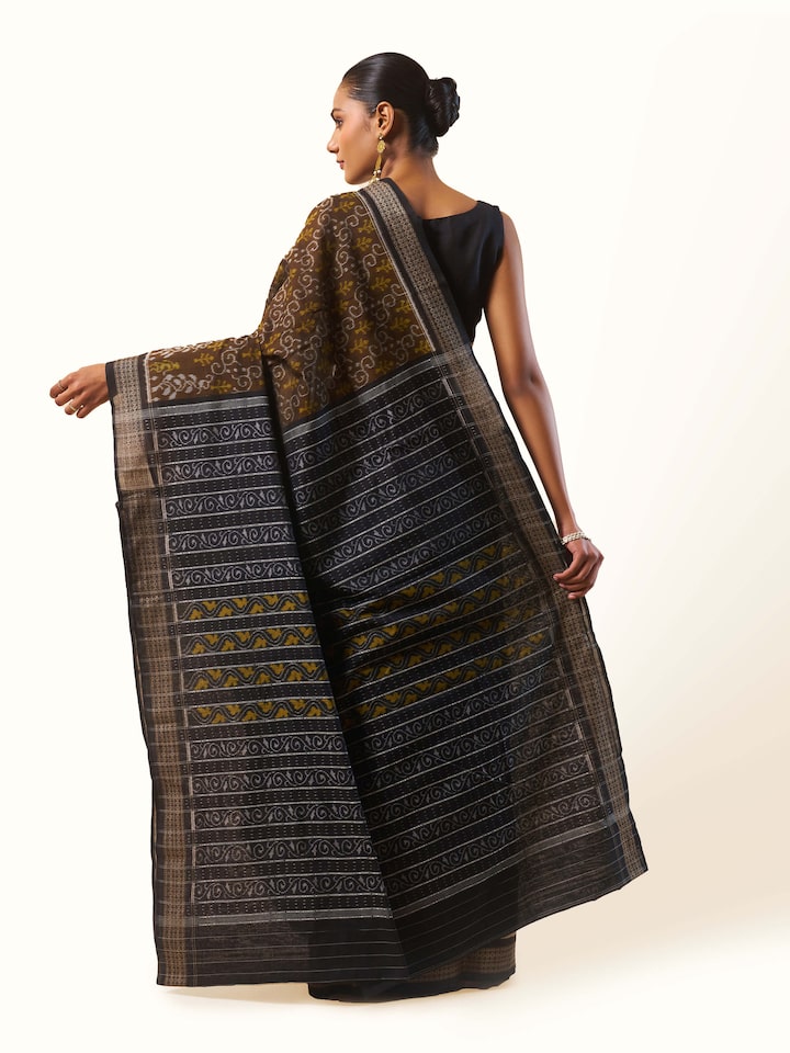 Back view of Brown Cotton Bandha Odisha Ikat Saree displaying full pattern and fabric texture
