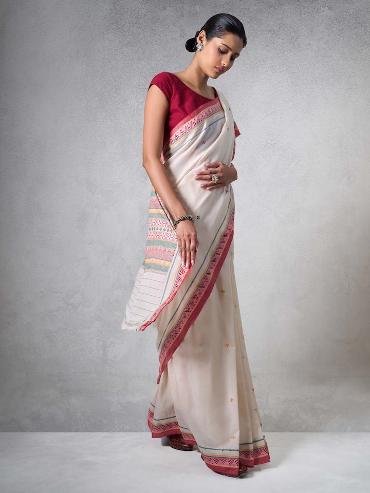 Angled view of Off-white Cotton Dongaria Saree highlighting cotton fabric and delicate weave