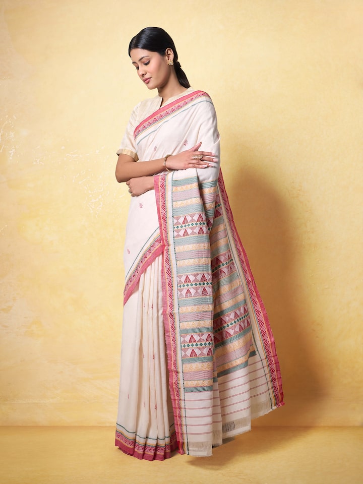 Lifestyle view of Off-white Cotton Dongaria Saree draped elegantly on model.