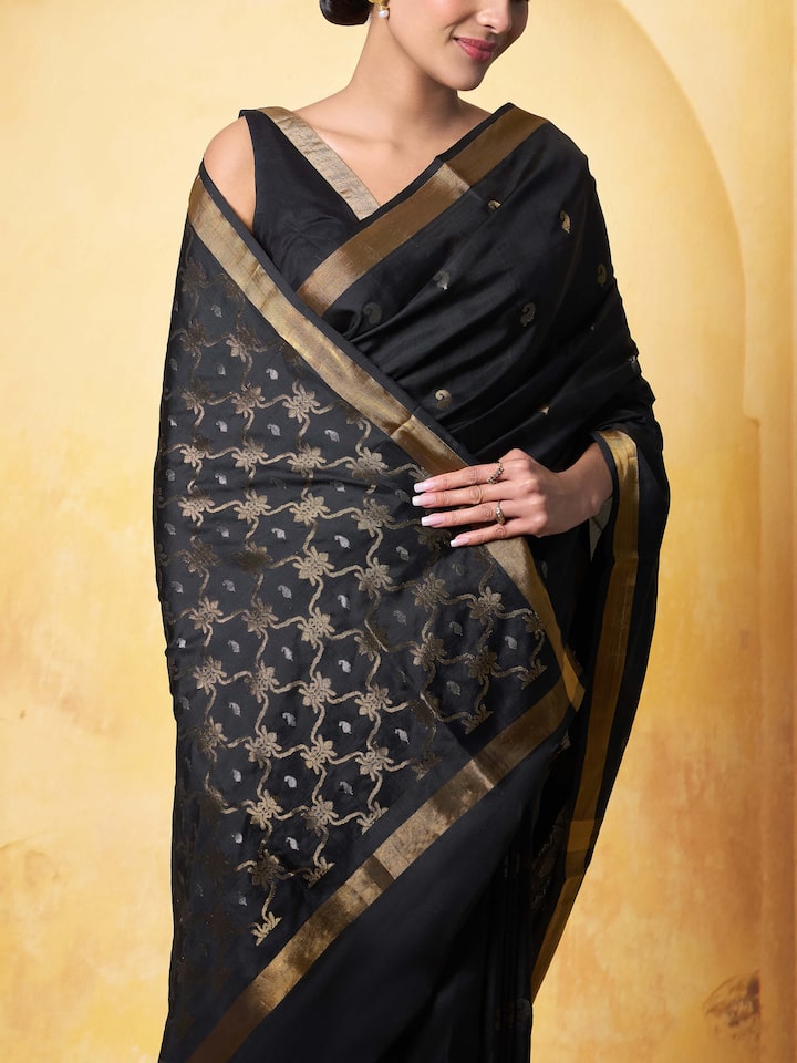 Detail shot of black mulberry silk Uppada Jamdani saree highlighting Jamdani weaving