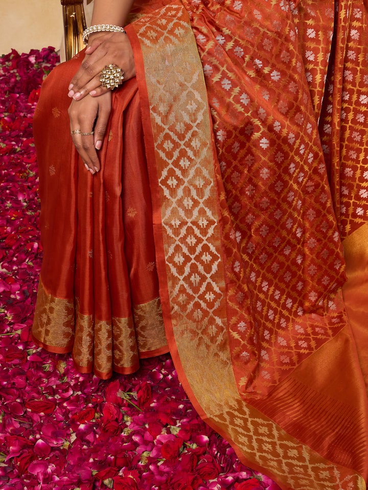 Detail shot of intricate Jamdani motifs on rust Uppada cotton silk saree