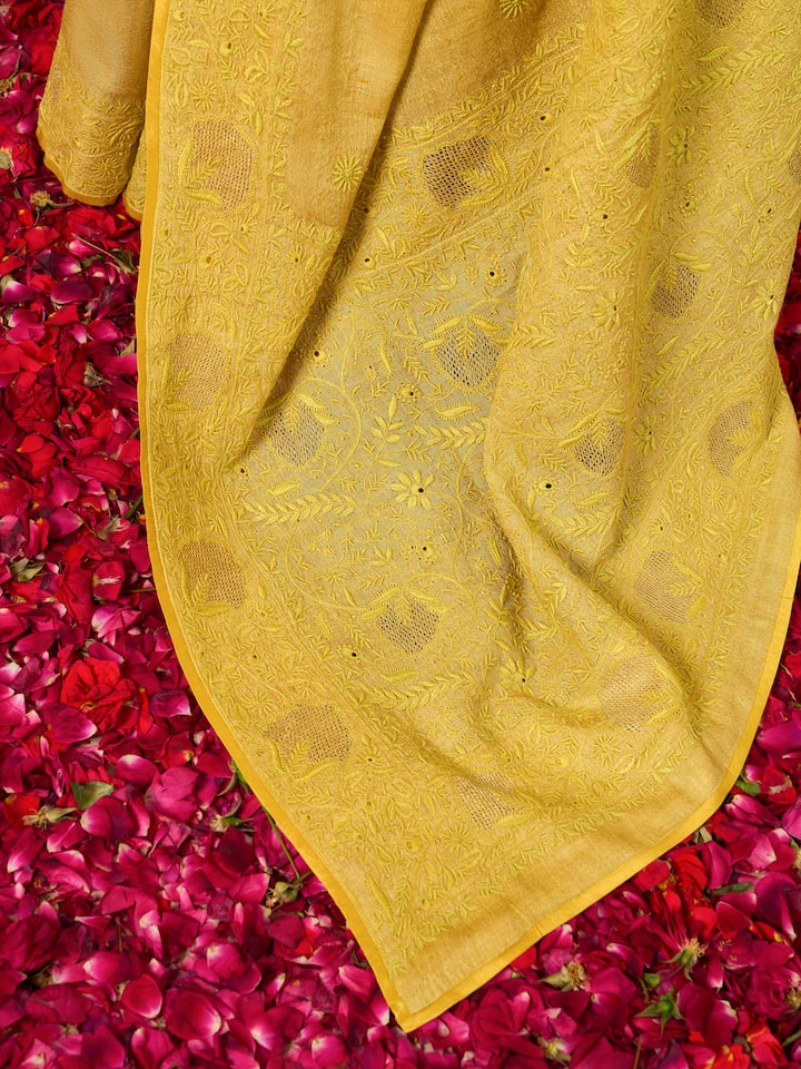 Angled view highlighting the intricate hand embroidery and soft silk texture.