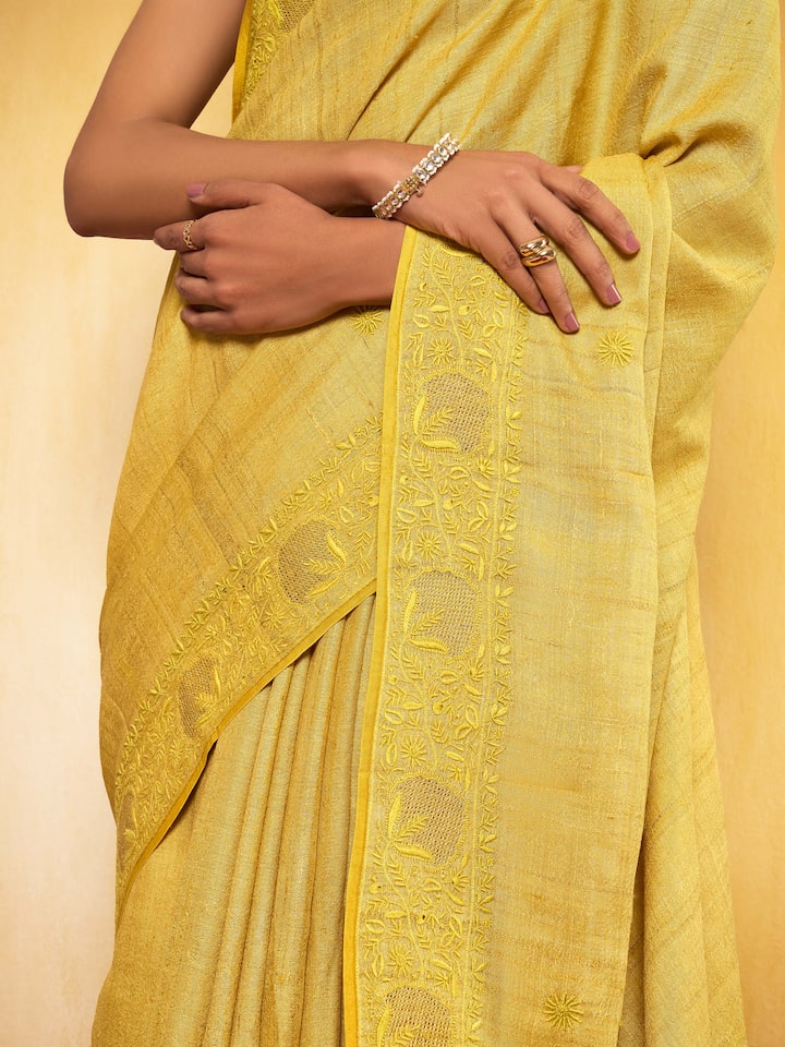 Side view showcasing the fluid fall and refined craftsmanship of the chikankari saree.
