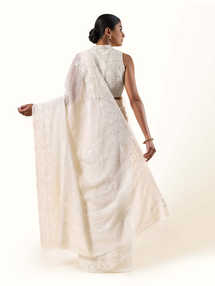 Back view highlighting pallu design and woven Jamdani patterns.