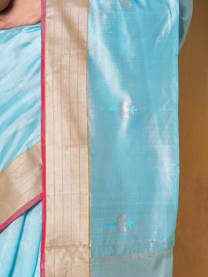 Side drape view of sea blue Chanderi saree on model, capturing the softness and translucent sheen.