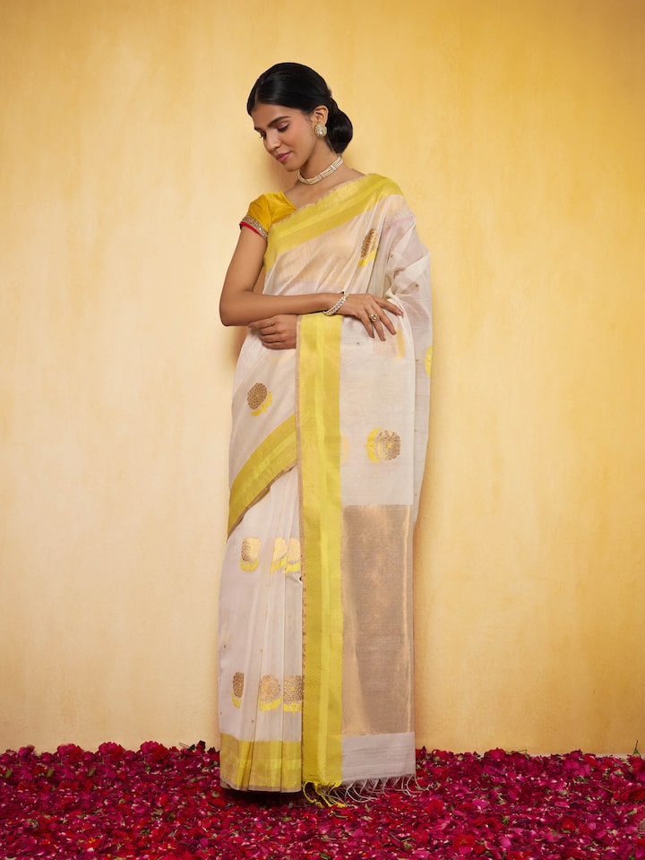 Off-white mulberry silk Chanderi saree lifestyle view styled on model highlighting drape and fabric flow