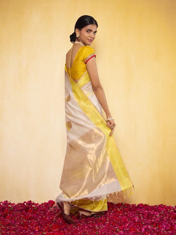 Off-white mulberry silk Chanderi saree angled view displaying fine Chanderi weaving and texture