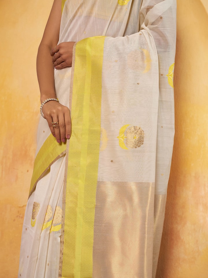 Off-white mulberry silk Chanderi saree detail shot capturing intricate zari work and fabric finish