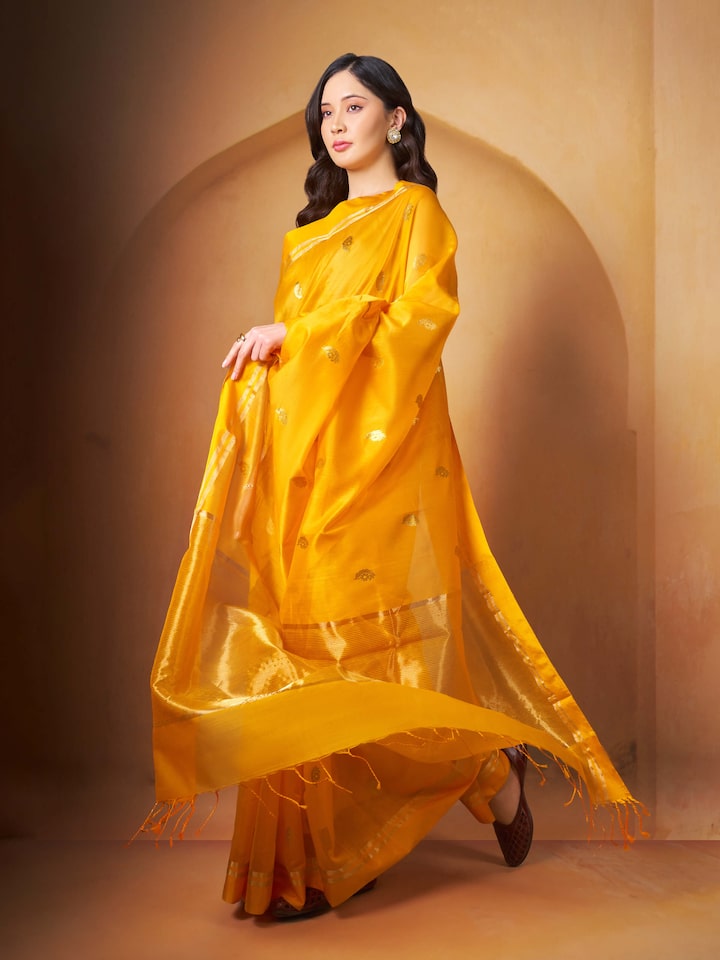 Lifestyle view of mango silk cotton Chanderi saree paired with complementary blouse