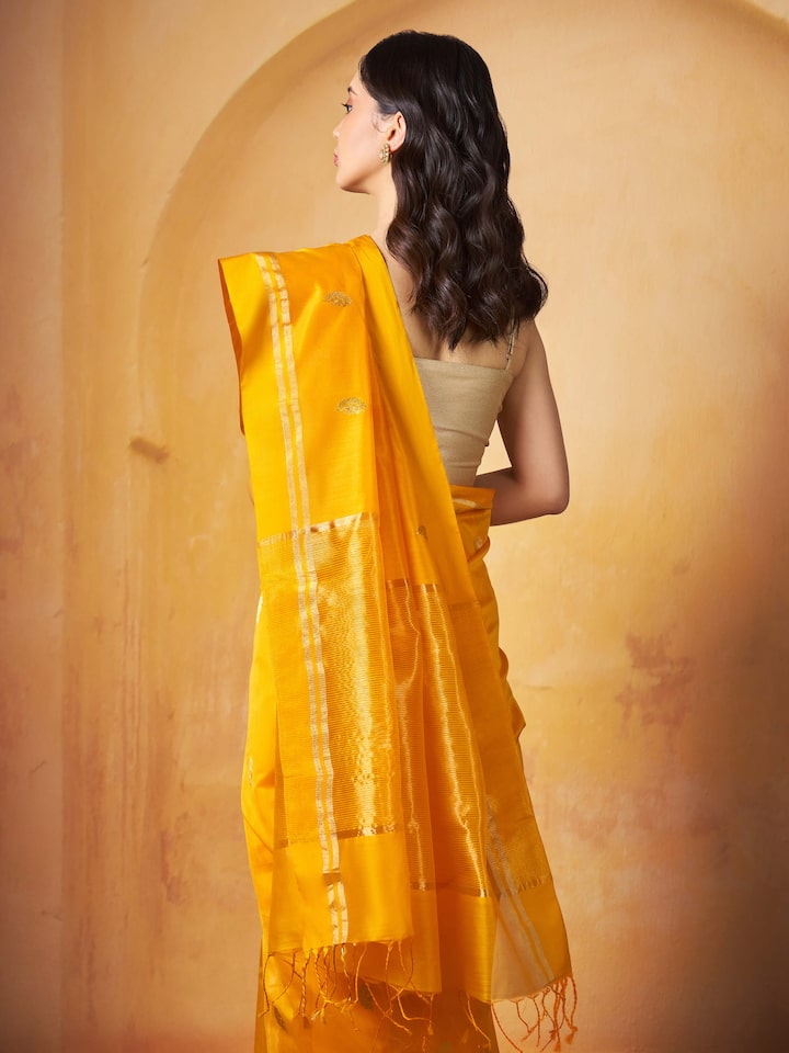 Angled lifestyle view showing drape and texture of mango mulberry silk cotton saree