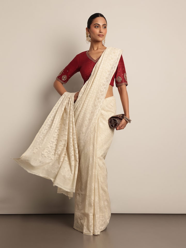 Off-white muslin cotton Jamdani saree lifestyle view draped gracefully showcasing pattern and soft fall