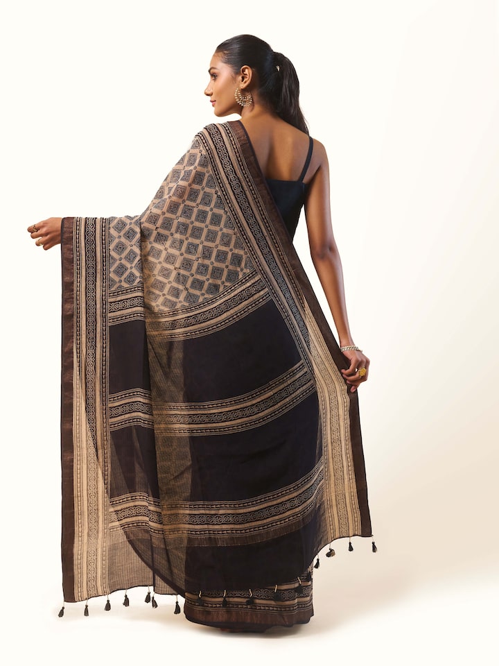 Back view of Black Maheshwari Ajrakh Block Printed Saree showing the pleats and finish