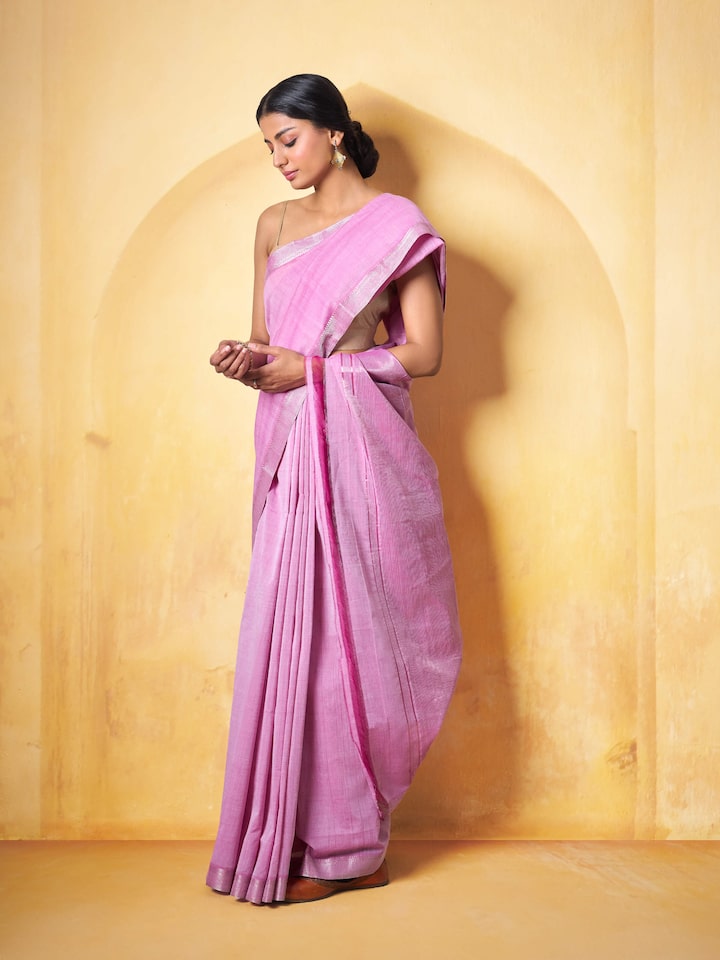 Lifestyle view of pink Mangalgiri saree draped elegantly with a complementary blouse
