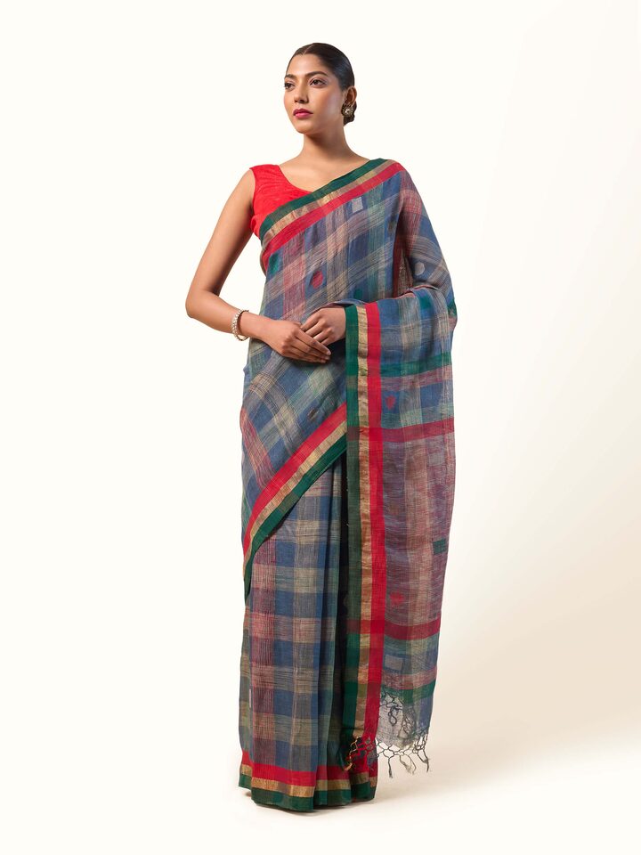 Model wearing Green Linen Cotton Saree shown front-facing with simple, elegant drape.