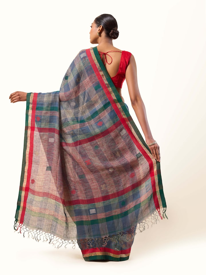 Back view of Green Linen Cotton Saree showing neat pleats and natural linen texture.