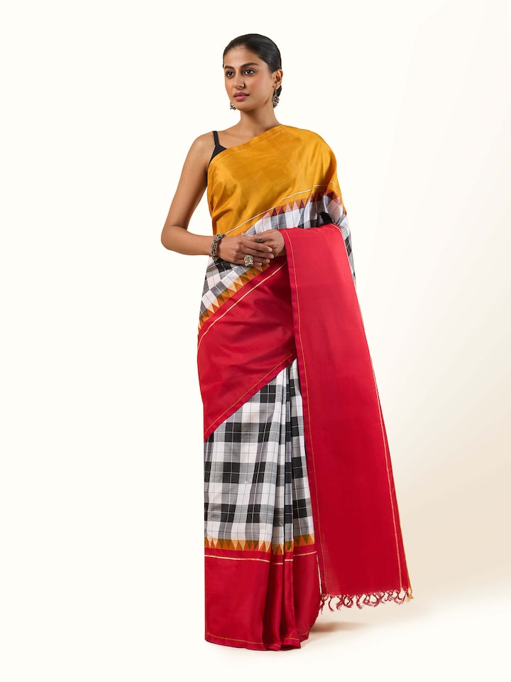 Front view of grey silk Kancheepuram saree showcasing traditional zari border and rich texture