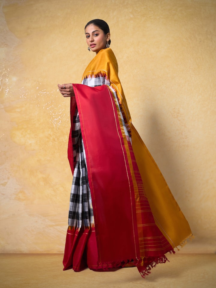 Lifestyle image of grey Kancheepuram silk saree styled for an elegant festive occasion