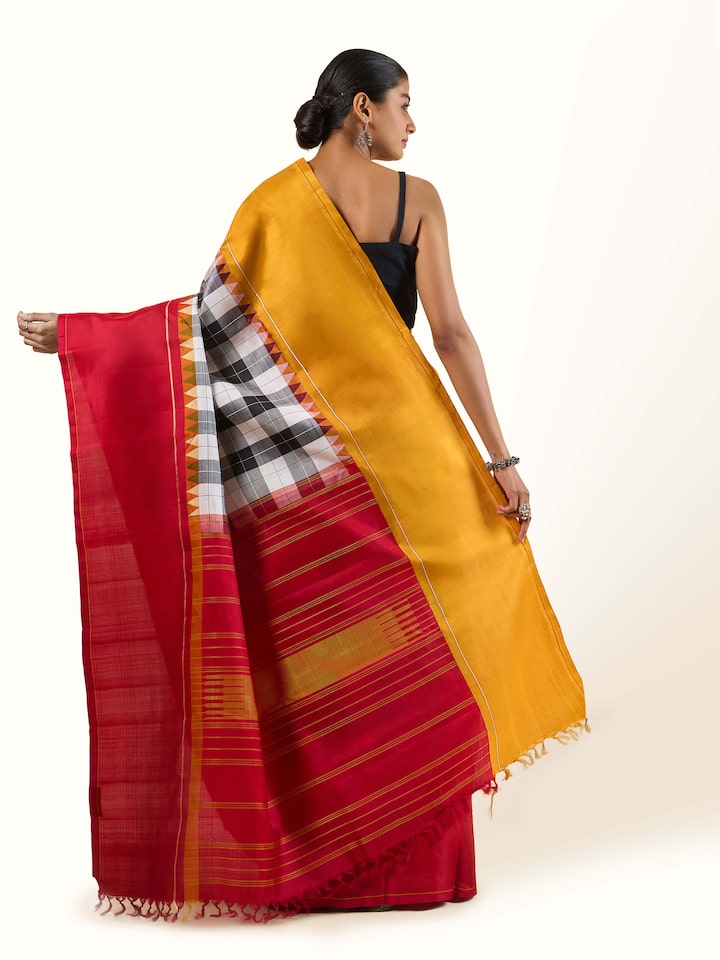 Back view of grey silk Kancheepuram saree capturing drape and pallu layout
