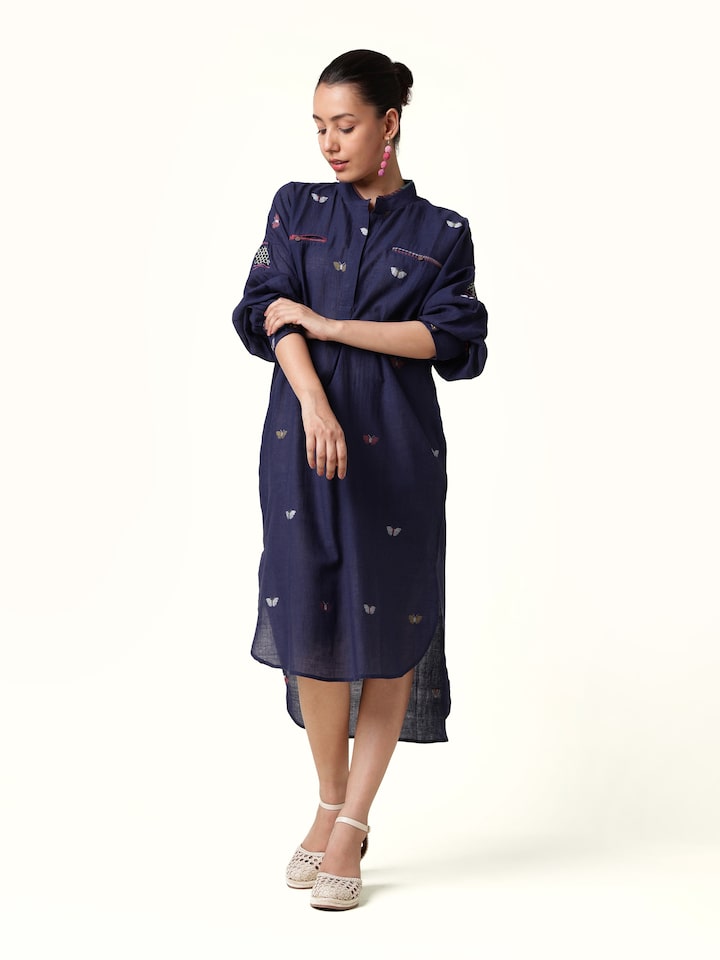 Front view showcasing the soft blue cotton shirt with Bengal Jamdani weaving details.