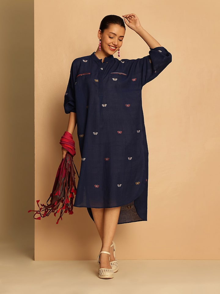 Lifestyle shot showing the contemporary take on the classic Jamdani with a long shirt silhouette.