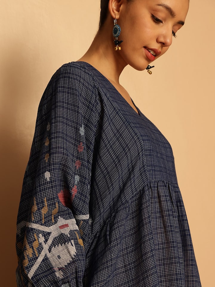 Alternate lifestyle view showing dress movement and texture of cotton Jamdani fabric