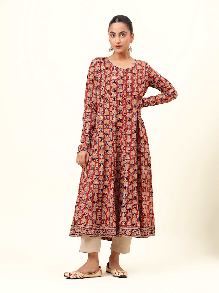 Front view of red cotton Kalamkari block printed kurta with round neckline and side slits