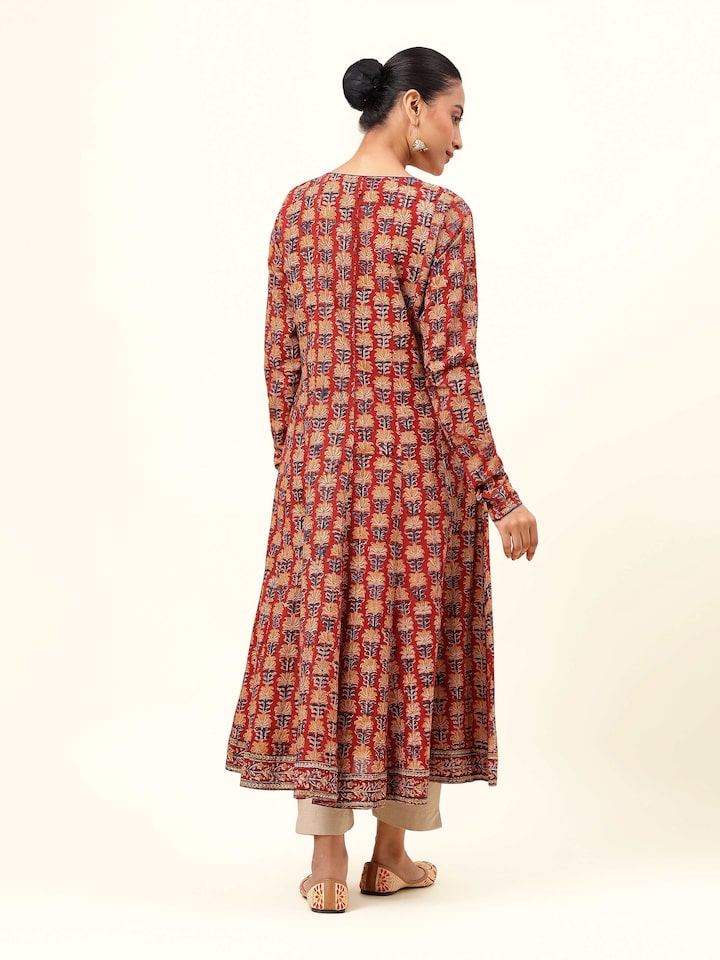 Back view of red cotton Kalamkari block printed kurta featuring yoke detail and fall