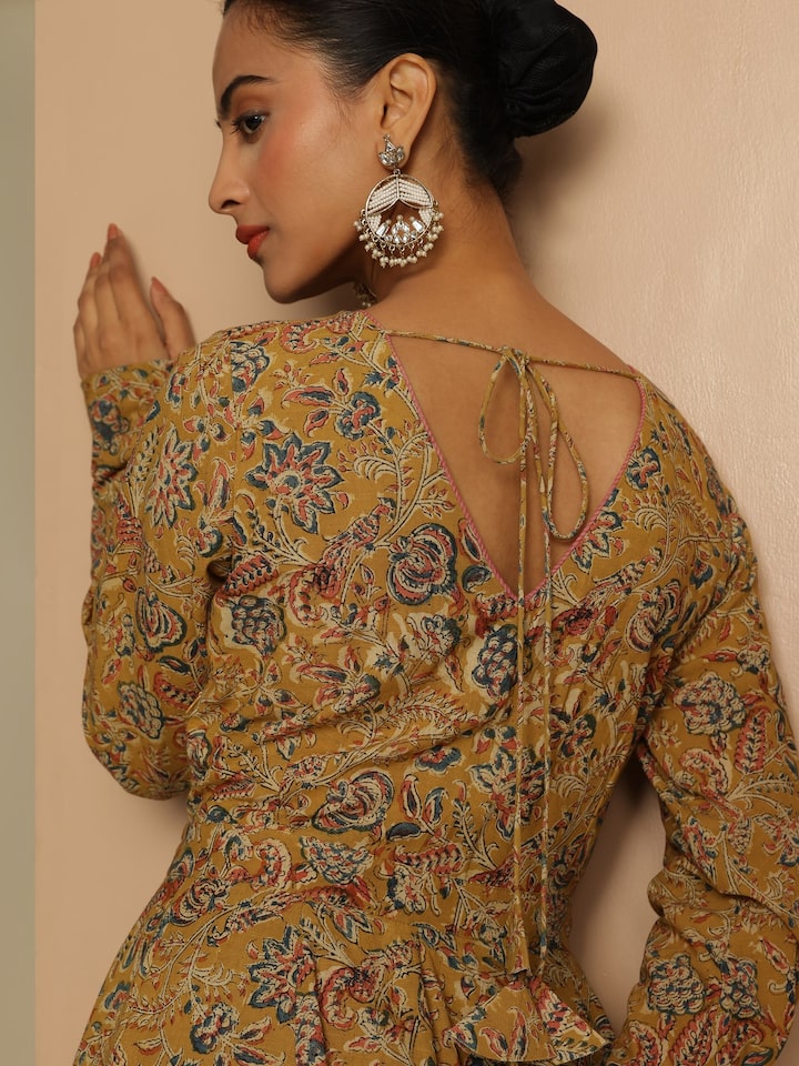 Angled view of model in Yellow Cotton Kalamkari Kurta showcasing artisan print and fit.