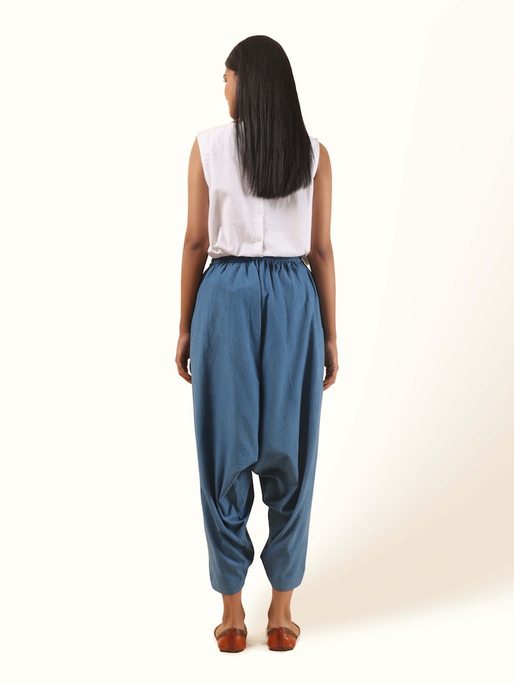 Back view of indigo cotton harem pants featuring gathered hem and comfortable fit