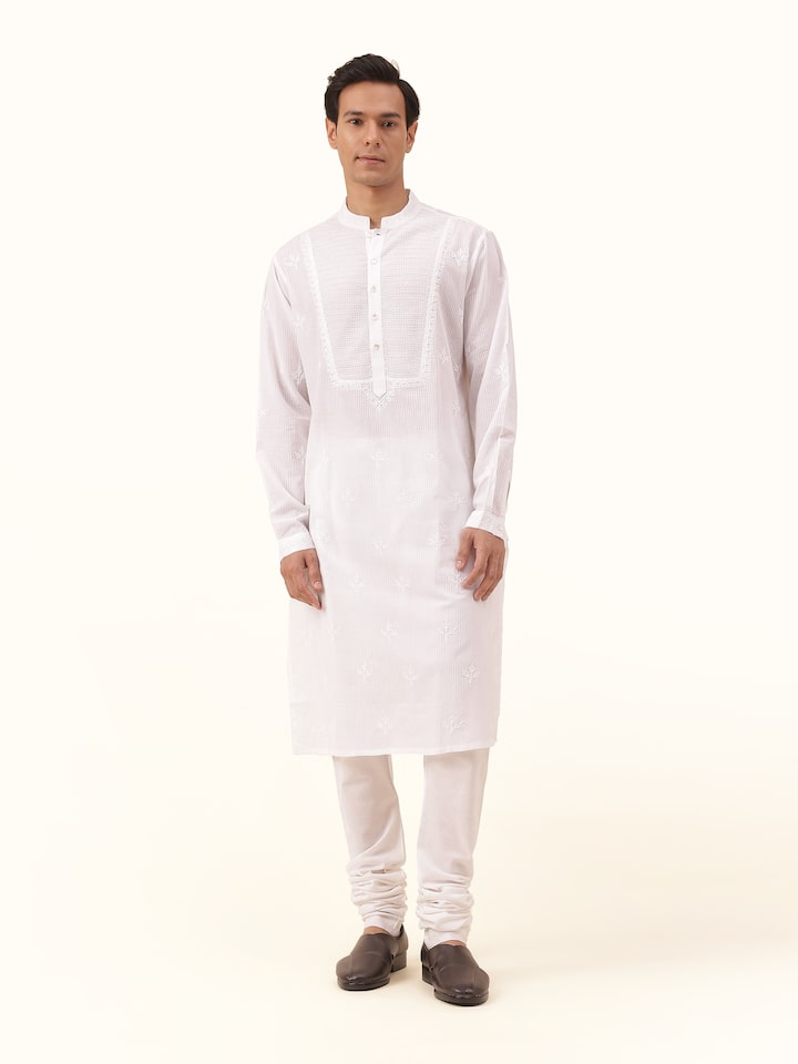 Front view of white cotton long kurta featuring elegant Chikankari embroidery on neckline and yoke